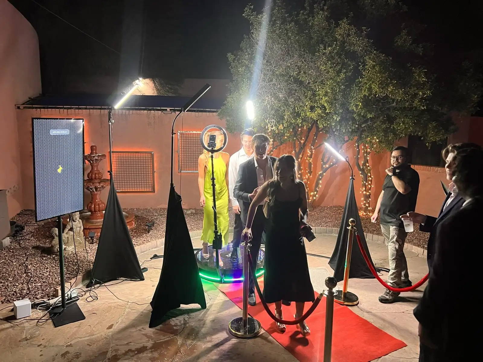 Guests on the 360 platform at an outdoor evening event